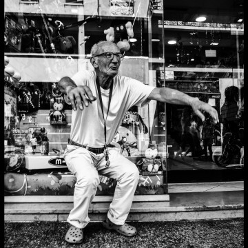 The Old Man, his Cigarette and the Toy Shop